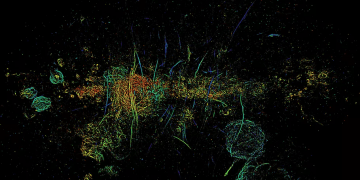 Immagine a mosaico del centro della Via Lattea osservato nella banda delle onde radio. Misteriosi filamenti energetici sono stati trovati nel cuore della galassia, e corrispondono a barre verticali in tutta l'immagine. Credits: Northwestern University/SAORO/Oxford University